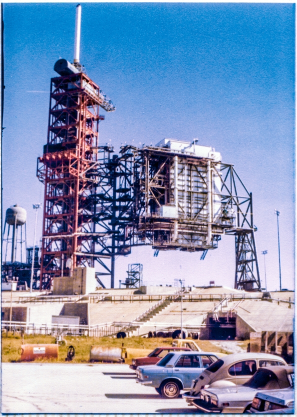Image 050. The Rotating Service Structure at Space Shuttle Launch Complex 39-B, Kennedy Space Center, Florida, begins to swing grandly back around to the demate position it was constructed in by Union Ironworkers from Local 808 working for Wilhoit Steel Erectors, following its initial rotational proof-test in which it was swung through 120 degrees of end-to-end travel, for the first time ever, into its mate position, spanning the Flame Trench. Photograph by James MacLaren.
